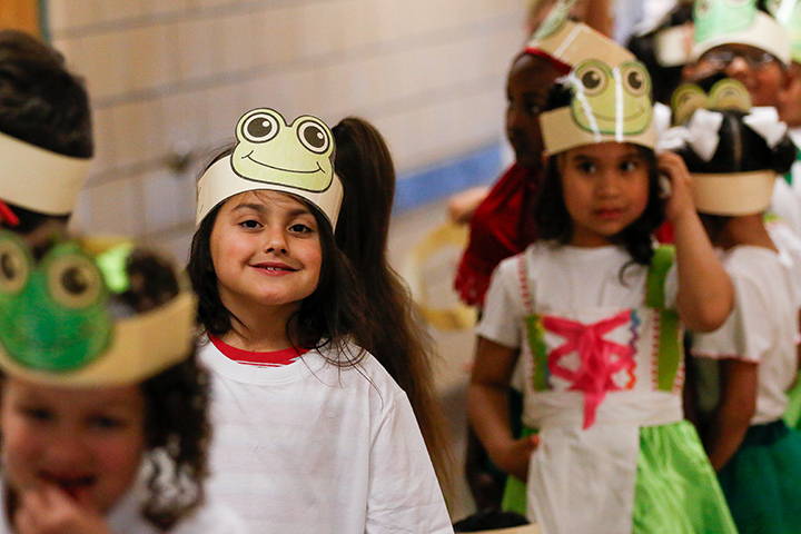 Students smile in their frog headbands