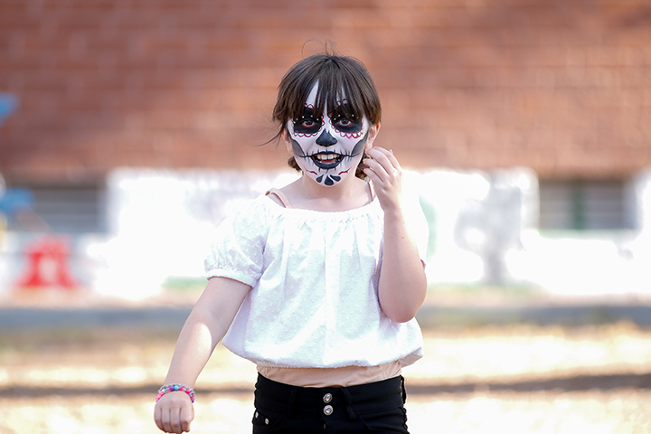 A girl shows off her face paint