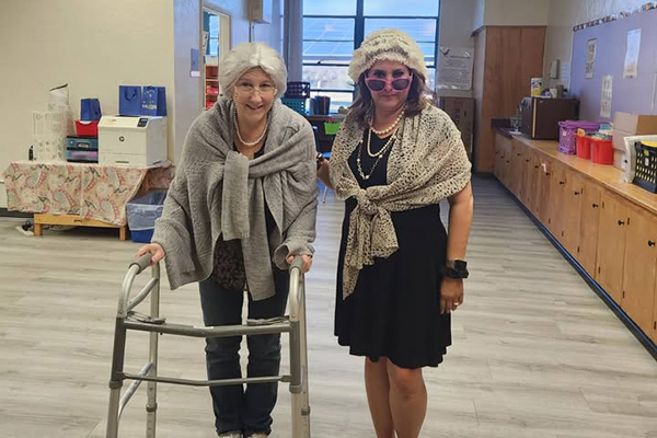 Two women dressed up as 100-year-old ladies