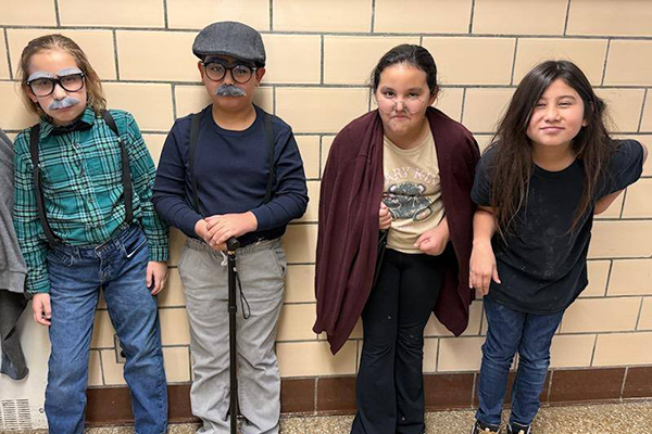 Four students dressed up as 100-year-olds